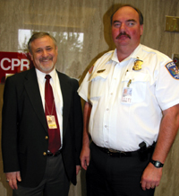 Craig Kalman stands outside of his office with a friend who works for the NIH police department