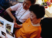 Picture of elderly women looking at photos