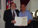 Congressman Neil Abercrombie visits with the 2004 Star of Life Award recipient Stacey Oho of Ewa Beach Hawaii during his recent visit to Washington, D.C. Oho received the award from the American Ambulance Association and American Medical Response. 