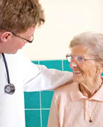 Photo of an elderly woman speaking to a doctor