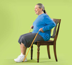 Photo of woman doing seated row with resistance band exercise