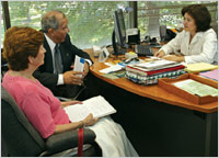 Photo of family visiting with physician