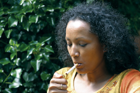 woman lighting a cigarette