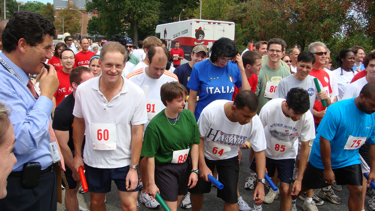 NIH director Dr. Elias Zerhouni (l) prepares to start one of two relay heats as racers take their marks.