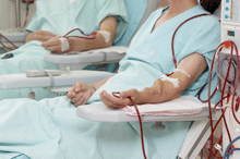 a photo of two patients on dialysis.