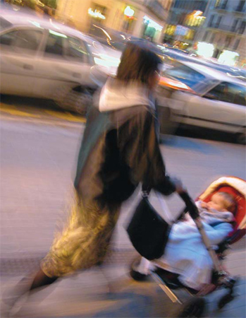 mom pushing stroller in the city