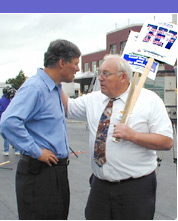 Inslee listens to a constituent.