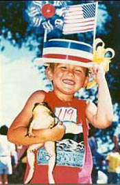 Participant in the frog jumping contest at the National Tom Sawyer Days celebration