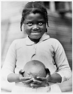 Girl holding a grapefruit