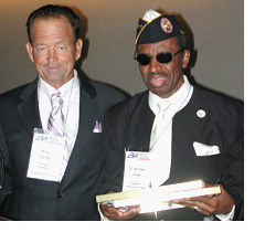 Photo of Roy Young accepting award from Dr. Norman Jones