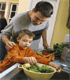 Dad and son cooking together