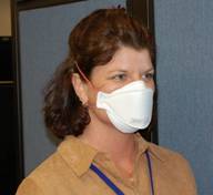 woman wearing flat fold N95 respirator