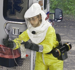 woman wearing powered, air-purifying respirator with loose-fitting hood