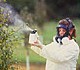 Woman spraying pesticides