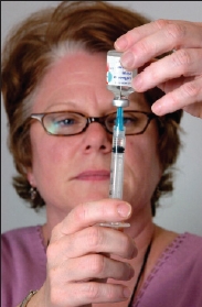 Vaccine being drawn  into a syringe
