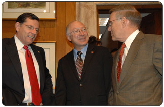 Secretary of the Interior Ken Salazar, center, confers with Senate Indian Affairs Committee Chairman Byron L. Dorgan, right, and Committee Vice-Chairman John Barrasso. [Photo Credit: Tami Heilemann, DOI-NBC]
