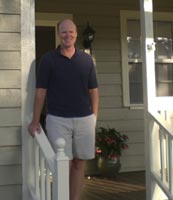 photo of John Lehrter in front of his house