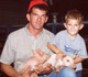 A father with his son and two pigs