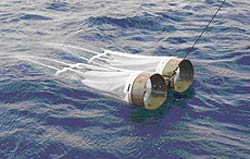 image of two net shaped like bongo drums skimming the water