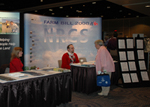 (from left) Louisiana NRCS office automation clerk Adlel Swearingen and Louisiana NRCS public affairs specialist Stuart Lee staff the NRCS booth.  (NRCS image -- click to enlarge)