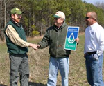 Bill Seybold, Delaware Forest Service (l.) meets with landowner Bill Jester and NRCS' John Bushey to discuss conservation planning