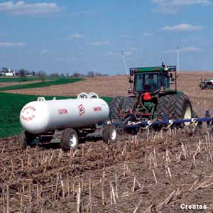 Photo: Fertilizer being applied to field at planting time.