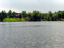 [photo:] Lake view with residential area in the background.