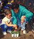 Child and Teacher Work in a School Garden