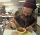 Man Eating at a Shelter