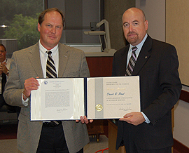 Dave Paul accepting an award from Technical Services Director Michael Gabaldon