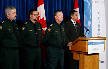 Minister Prentice at a press conference on new Enforcement Bill.  Photo: Environment Canada © 2009.