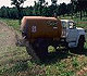 Fertilizer truck spraying manure slurry.