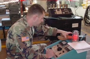Photo of a Soldier performing an integrity test on a vacuum bottle