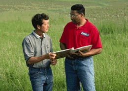 A local NRCS staff person discussing conservation planning activities with a landowner.