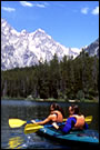 Rural recreation: Kayaking on a mountain lake.