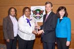 Jackson State University receives the President's Higher Education Community Service Honor Roll for Hurricane Relief. Pictured (L-R): Fentry Richards, Student; Dr. Valerie Shelby, Director, Community Service/Service Learning Center; Stephen Goldsmith, Chairman of the Board, Corporation for National and Community Service; and Amy Cohen, Director, Learn and Serve America.