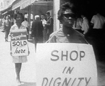 In 1962, African American women in Albany, Georgia, are arrested for picketing in front of Albany City Hall and nearby Lane Drugs.