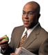 African American business man eating an apple.