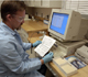 Kevin Bentler, a Biological Science Technician, enters barcode numbers from fecal samples at the wildlife disease laboratory at the USDA National Wildlife Research Center in Fort Collins, Colorado