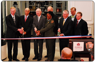Secretary of the Interior Ken Salazar, center,  cuts the ribbon at the re-opening of  Ford's Theatre National  Historic Site on Feb. 11, 2009.  Participating in the ribbon-cutting are, from left, D.C. Council Member Jack Evans; Mayor Adrian Fenty; Secretary Salazar; NPS acting Director Dan Wenk (behind Secretary); NPS superintendent Kym Elder; Abraham Lincoln Bicentennial Campaign Chairman Rex Tillerson; Paul Tetreault, managing director of the Ford's Theatre Society; and Wayne Reynolds, chairman of the society's Board of Trustees.  [NPS photo by Terry Adams] 