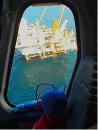 Picture of Energy Ant overlooking offshore rig from inside a helicopter.