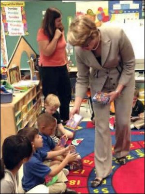 Secretary Spellings distributes books to students at Belle Chasse Primary as part of the U.S. Department of Education's No Child Left Behind Gulf Coast Summer Reading Initiative with First Book in Belle Chasse, Louisiana.