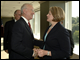 Secretary Spellings greets Representative Buck McKeon after speaking to members the Business Coalition for Student Achievement in Washington, D.C.