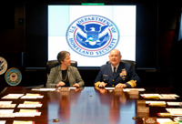 Secretary Napolitano and Coast Guard Commandant Adm. Allen listen to a briefing on global Coast Guard operations. (U.S. Coast Guard Photo/Bender)