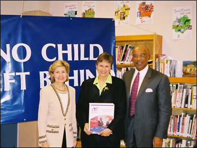 U.S. Secretary of Education Rod Paige and U.S. Senator Kay Bailey Hutchison visit with teachers, students and the principal (middle) of the Young Women's Leadership School in New York City on May 30, 2002, to see first-hand one of the most prominent single-sex public schools in the country.