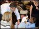 Through Horton's Kids, a nonprofit organization that serves more than 200 children living in Anacostia, Department employees, shown here with the Secretary, tutor students from some of of D.C.'s neediest schools every week for an hour.