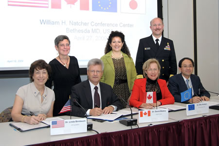 Linda Birnbaum, David Blakey, Elke Anklam, and Hajime Kojima representing Masahiro Nishijima of Japan. Standing are Marilyn Wind, Michelle Limoli of FDA, and William Stokes.