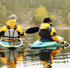 Photo of two people kayaking