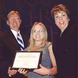 Photo of Cheryl Osborne receiving award
