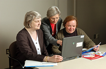 Members of SEER, (Surveillance, Epidemiology and End Results) review their collection of data, in preparation for a new report on cancer incidence and survival.